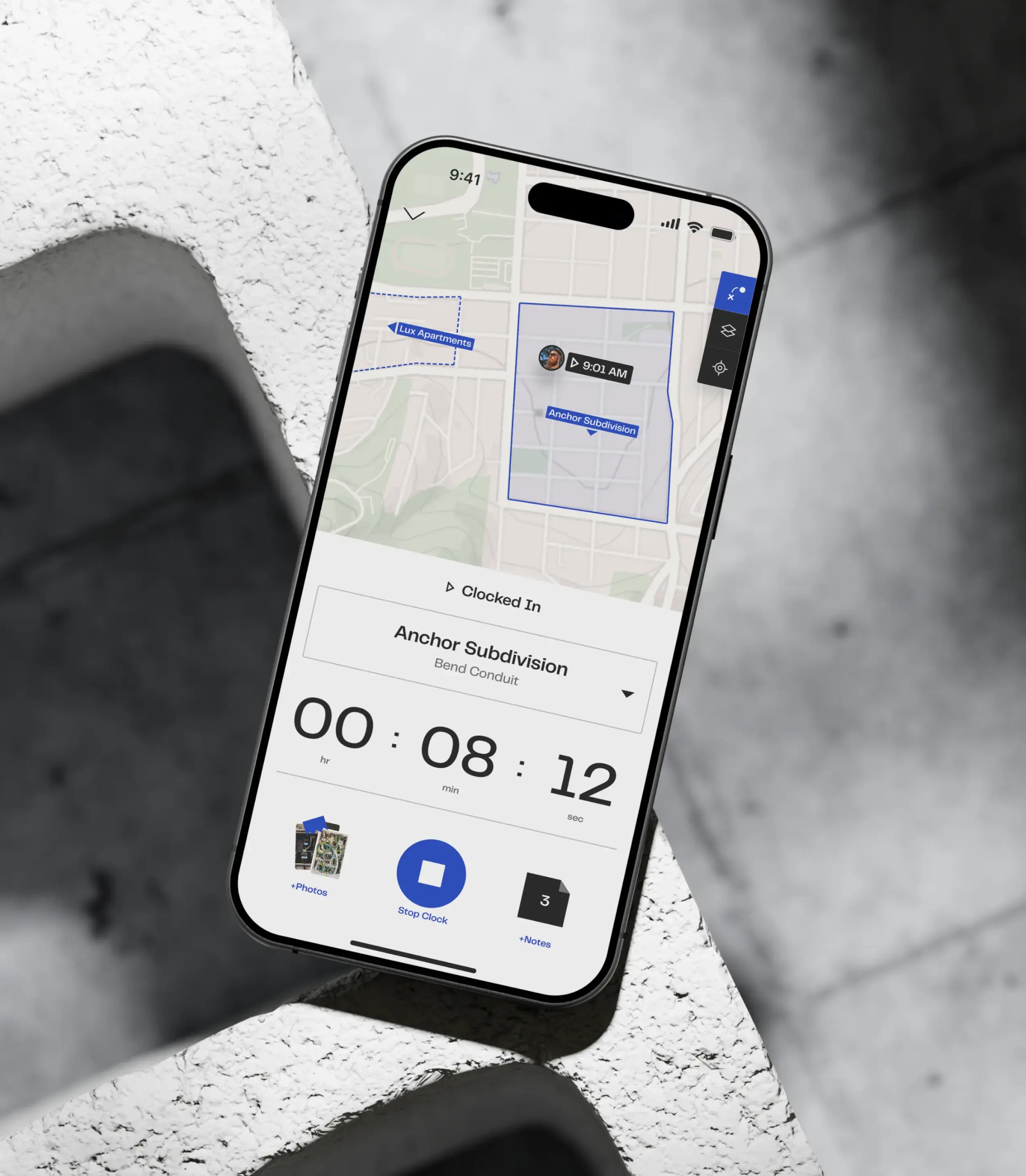 Worker time recording on Trades app in construction scene