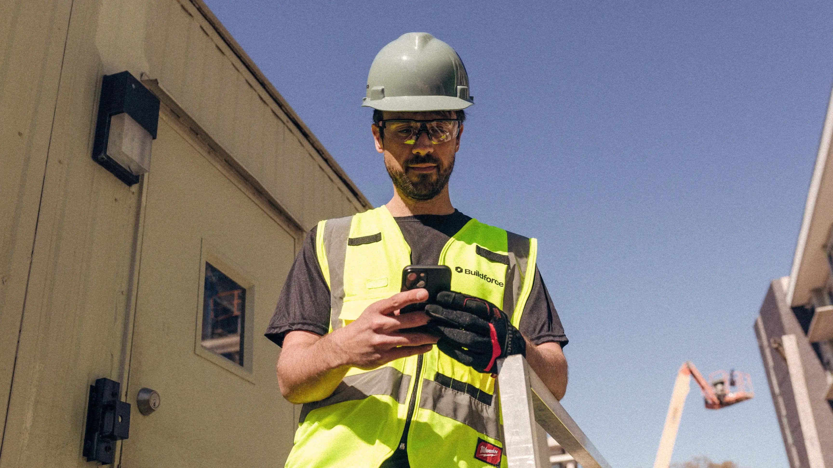 Buildforce electrician using mobile phone